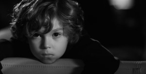 "I could never work with a team member who questioned my decision to shoot the film in black-and-white," says Hunter Lee Hughes. Luke Judy as The Boy. Photo by Michael Marius Pessah