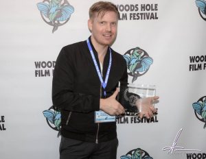 Director Hunter Lee Hughes receiving the Audience Award for "Guys Reading Poems" at the 25th annual Woods Hole Film Festival.